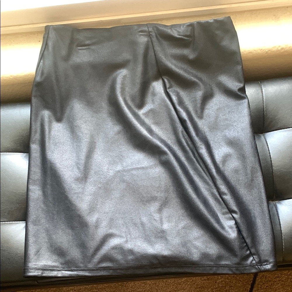 Skirt by Naked. Never worn. Mini skirt. Material has a shine to it